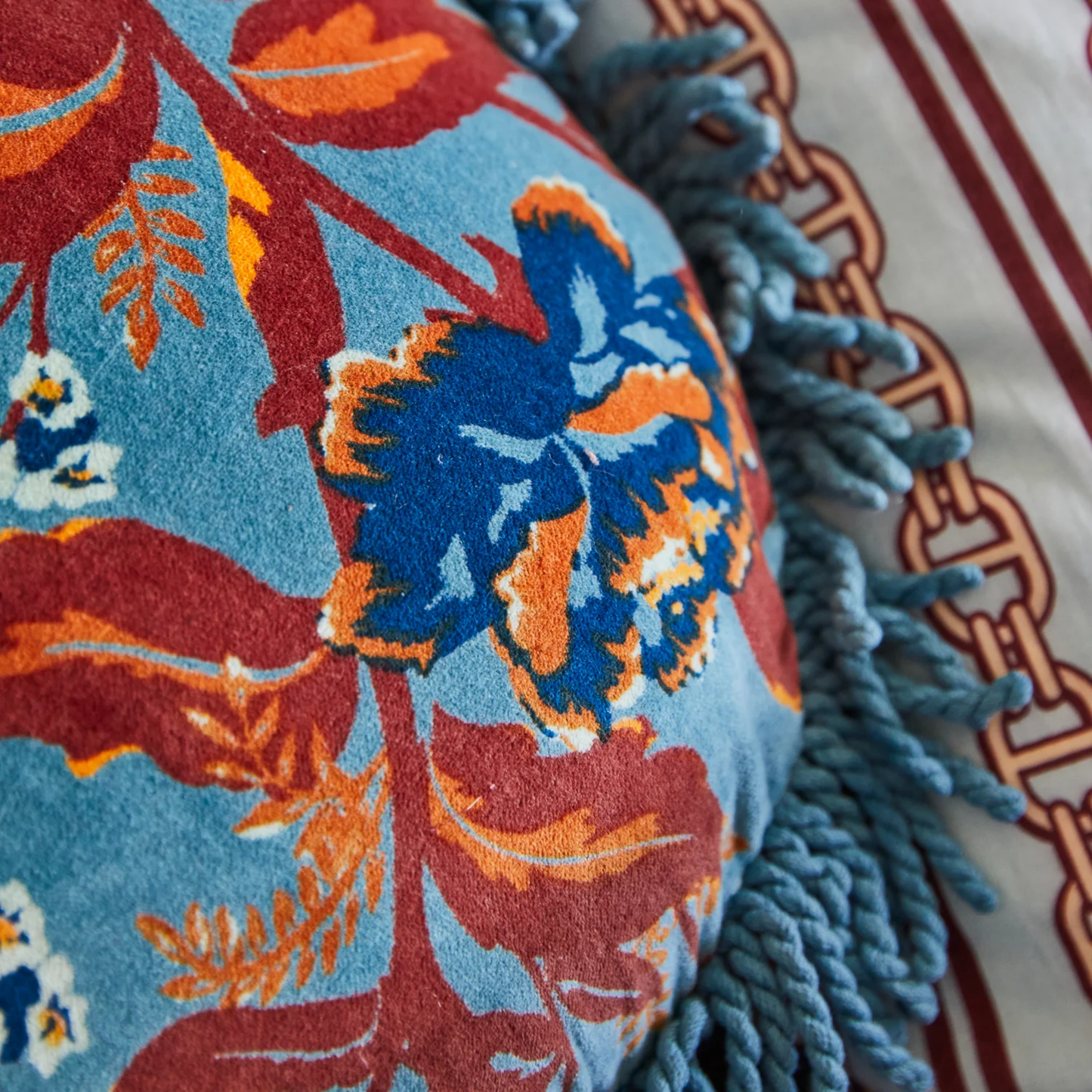 Upclose of Sage x Clare Velvet Margot Celeste round velvet cushion featuring a soft-touch plush velvet front, cotton reverse, and fringe edges - includes premium feather or vegan insert for a super-soft, luxurious feel.