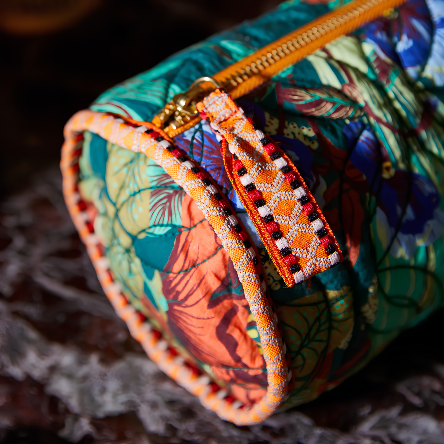 Close up on the zipper and the cord piping on one side of the Sage & Clare Makeup Bag Babette round and roomy with wide zip opening, lightly quilted and a compact design.
