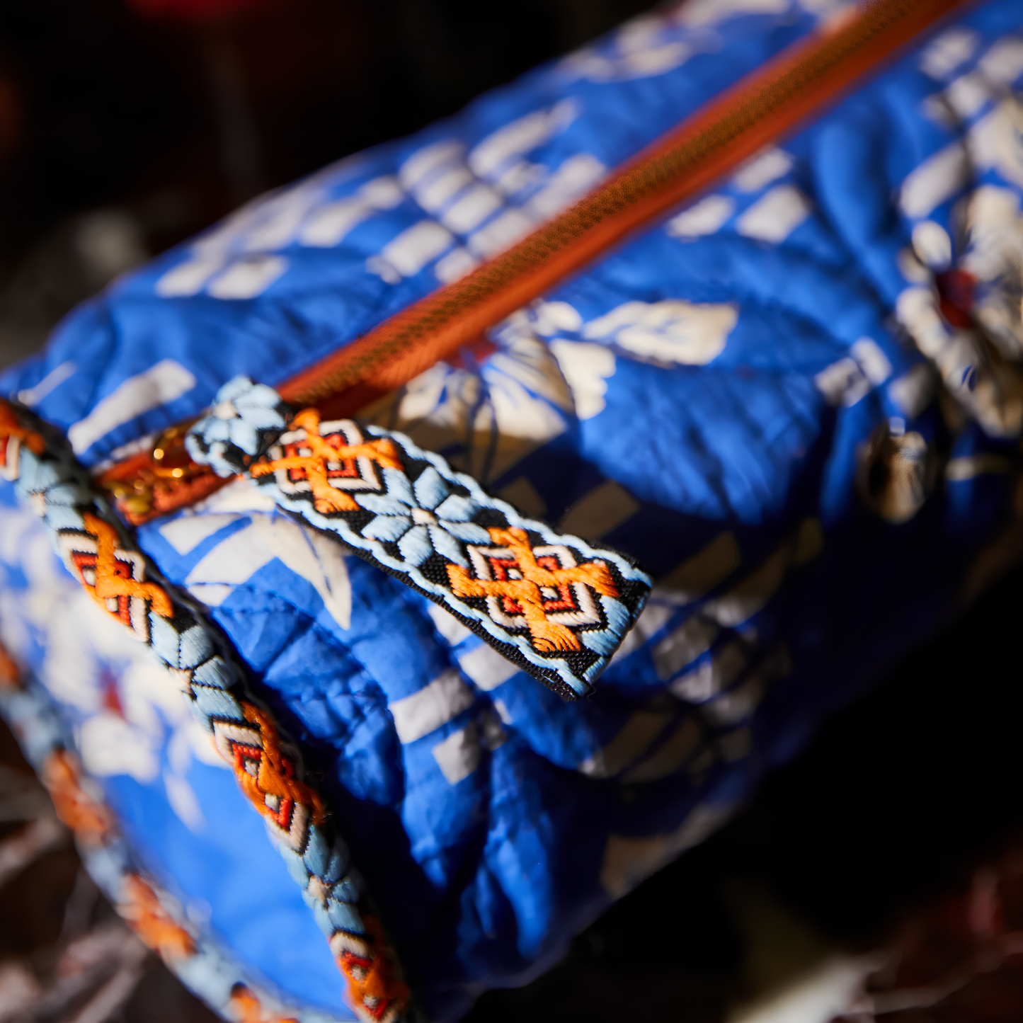 Close up of the Sage & Clare Makeup Bag Marta Ultramarine round and roomy with wide zip opening, lightly quilted and a compact design.