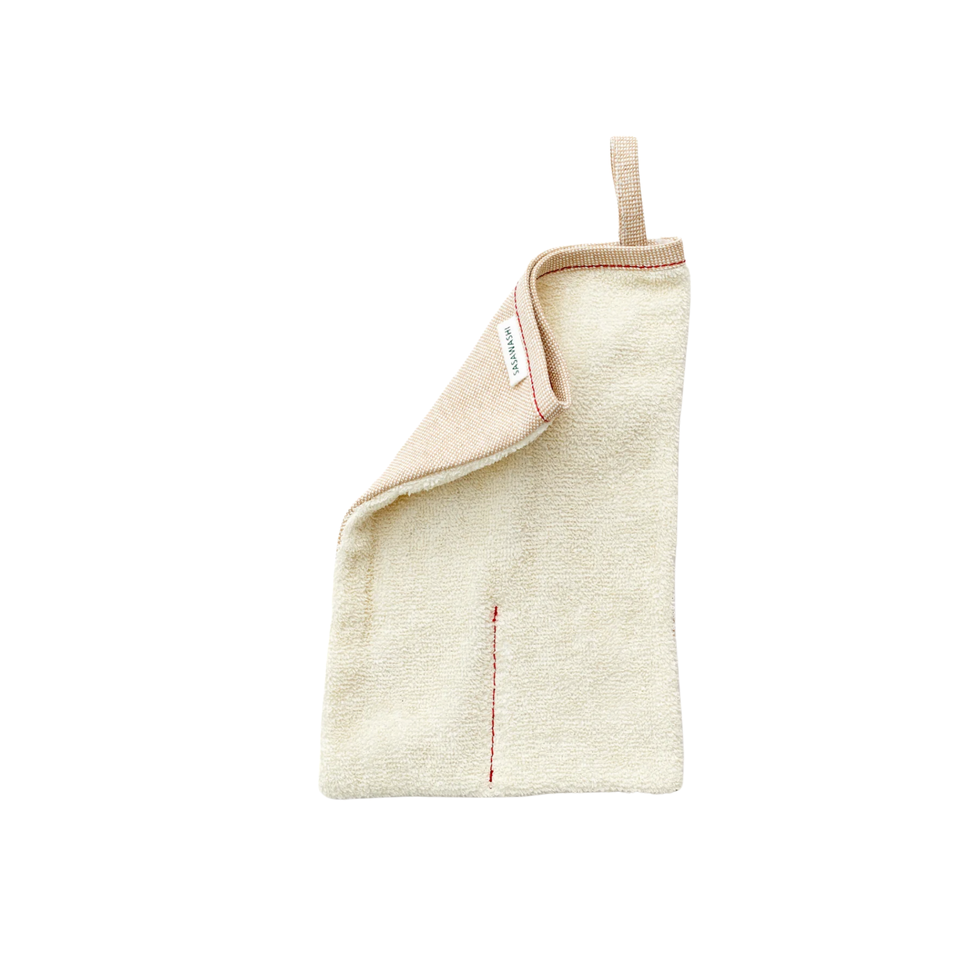 Sasawashi body scrub mitten out of packaging with folded corner