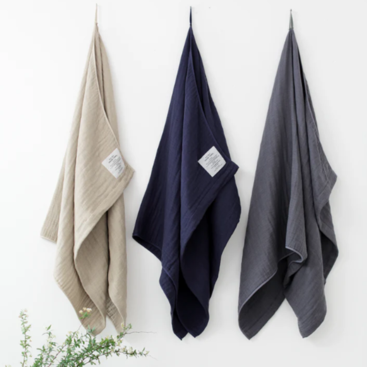 Shown in the right being hung with other towel colors, Shinto 2.5 Ply Gauze Bath Towel - Beige, 100% organic cotton, large 140x88cm, soft, fast-drying, feather-light, highly absorbent, Japanese-made.