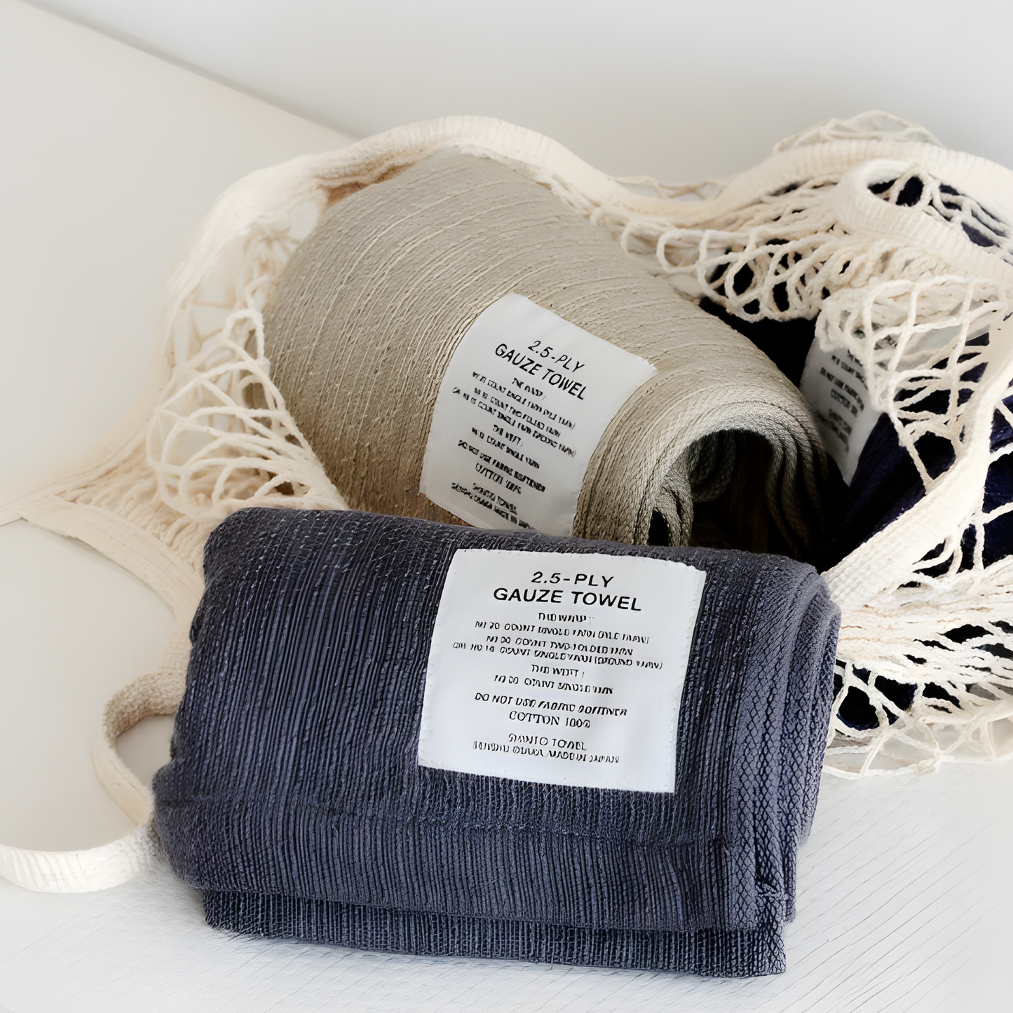 Shown folded Shinto 2.5 Ply Gauze Hand Towel - Charcoal, 100% organic cotton, long 115x30cm, soft, fast-drying, feather-light, highly absorbent, Japanese-made.