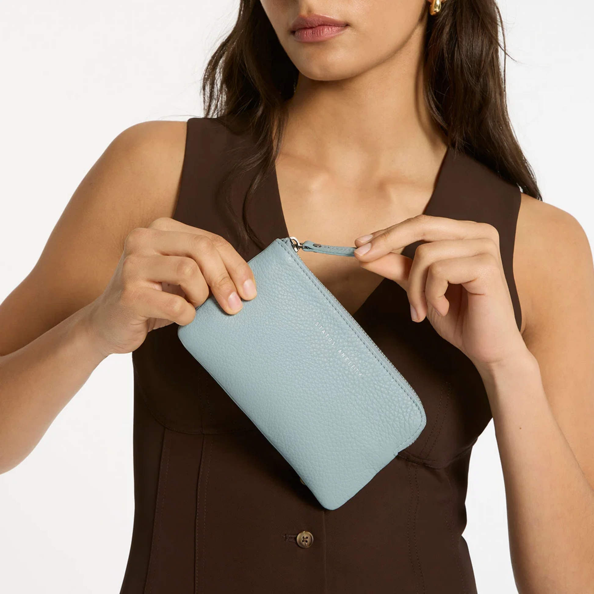 Front view of the Status Anxiety Wallet Smoke And Mirrors Powder Blue from soft shrunken pebble leather with 4 card slots.