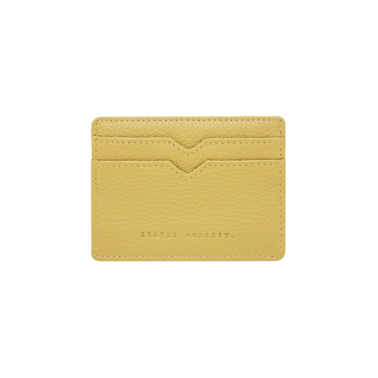Front view of the Status Anxiety Wallet Together For Now Buttermilk Soft shrunken pebble leather with 4 card slots and stash pocket.