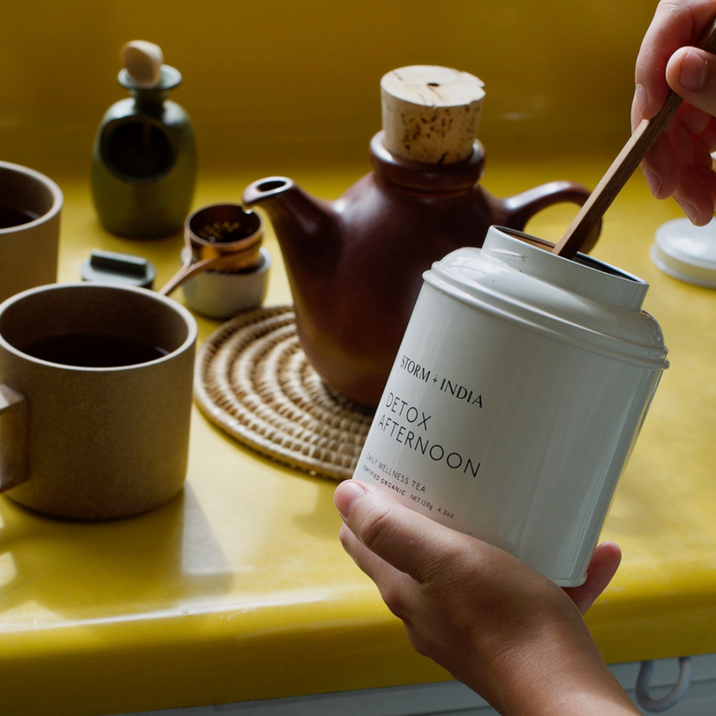 Storm and India Loose Leaf Tea in Tin 120g Detox Afternoon being used in yellow kitchen to brew tea