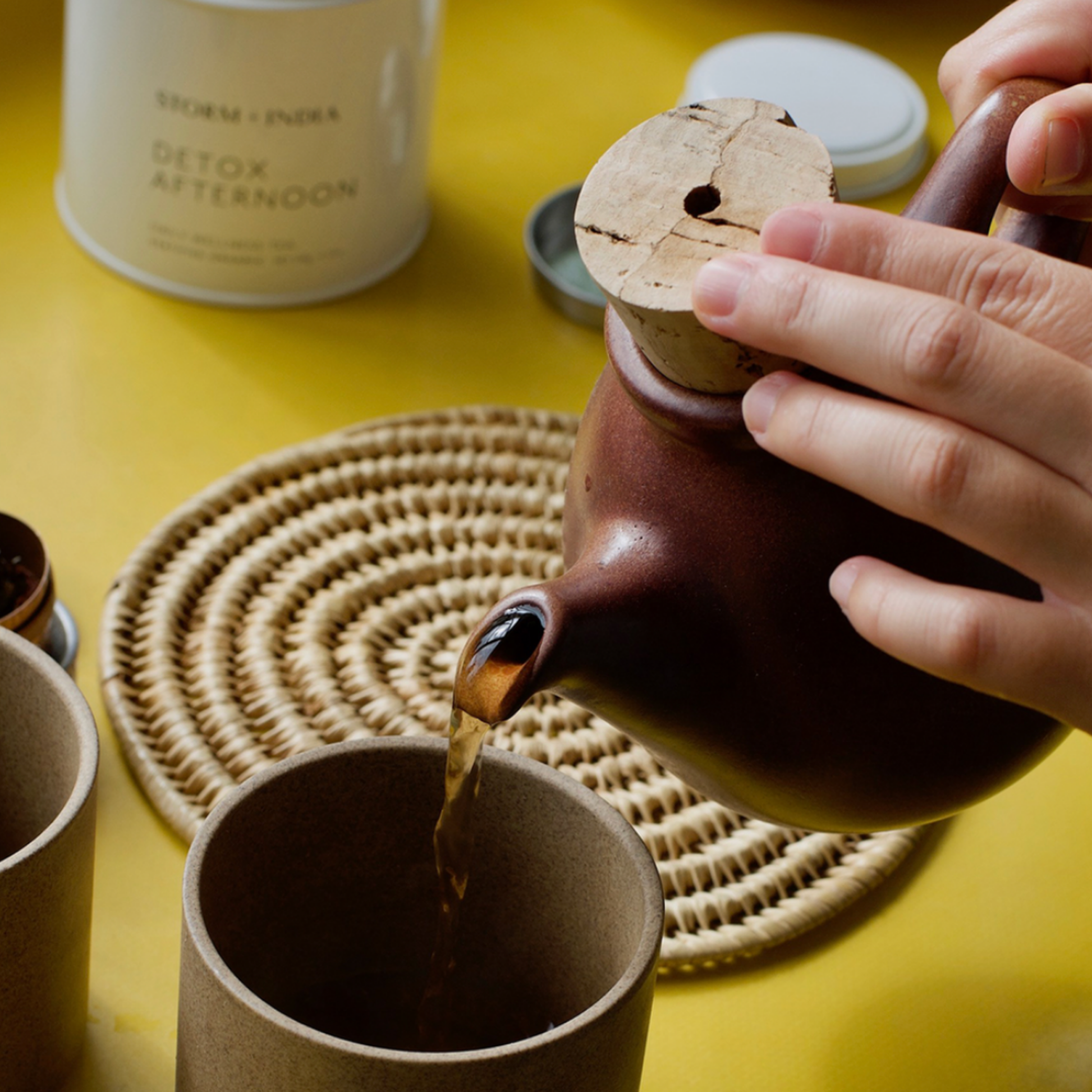 Storm and India Loose Leaf Tea in Tin 120g Detox Afternoon in background in yellow kitchen while tea is being poured from teapot