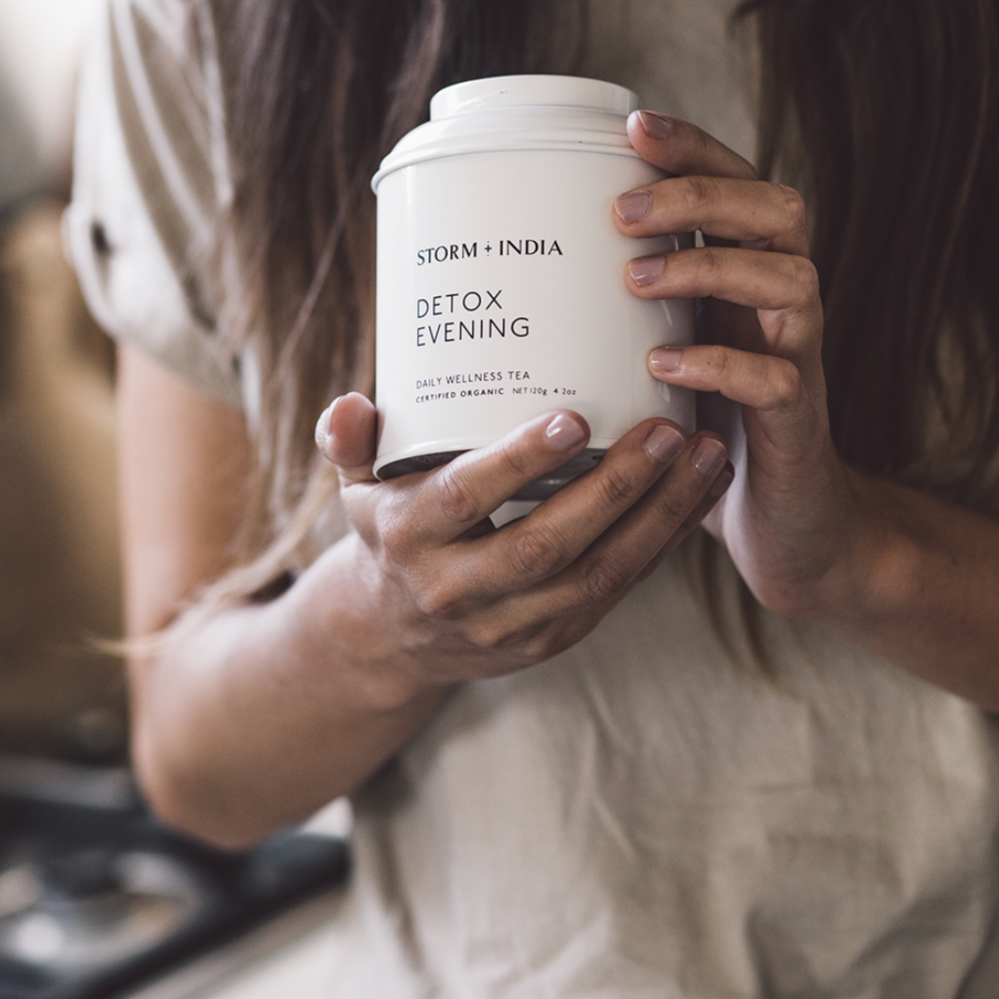 Woman holding Storm and India Loose Leaf Tea in Tin 120g Detox Evening
