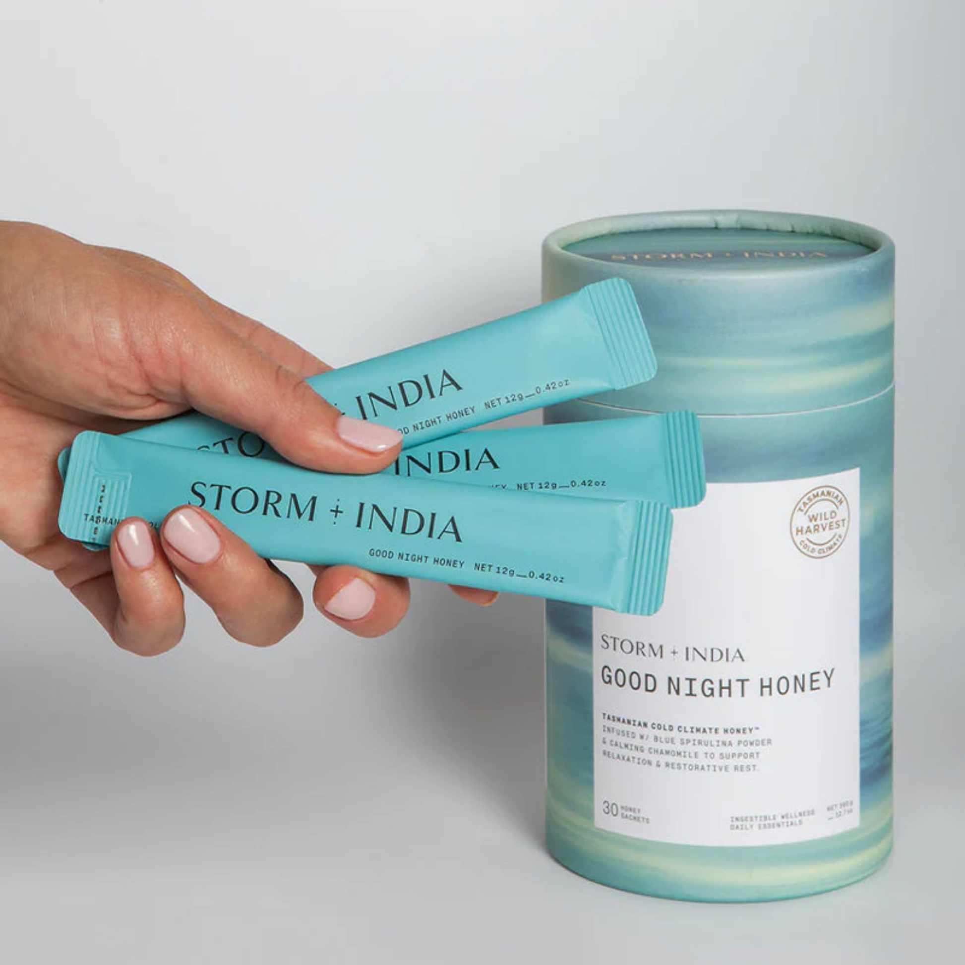 Sachet and container image of Storm + India Good Night Honey 360g, 30 sachets, honey blend with blue spirulina, chamomile, and lavender.