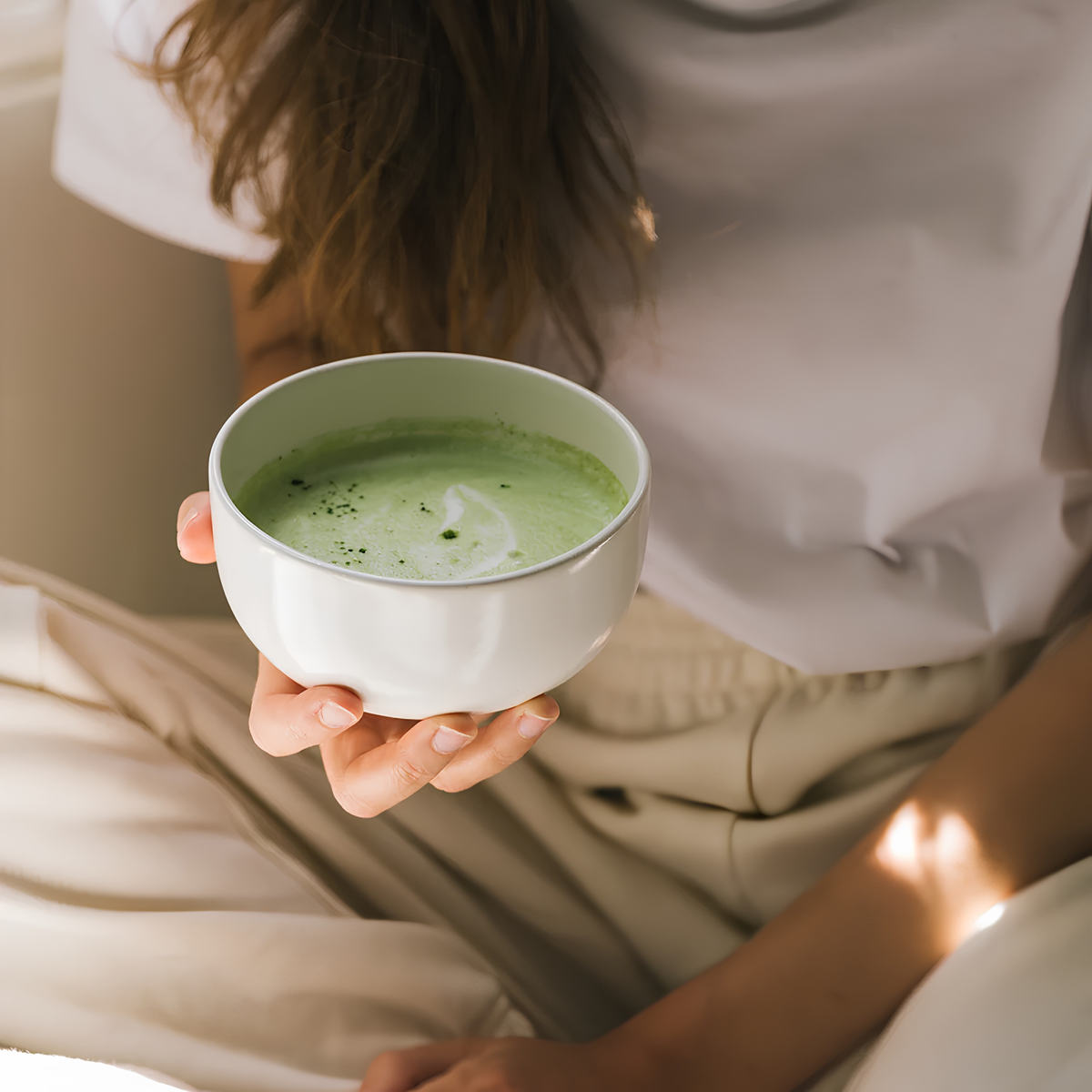A matcha mixture inside a bowl, from Storm & India Mood Matcha grown on pristine organic farms, shaped by volcanic soils and warm ocean air in Pouch 100g