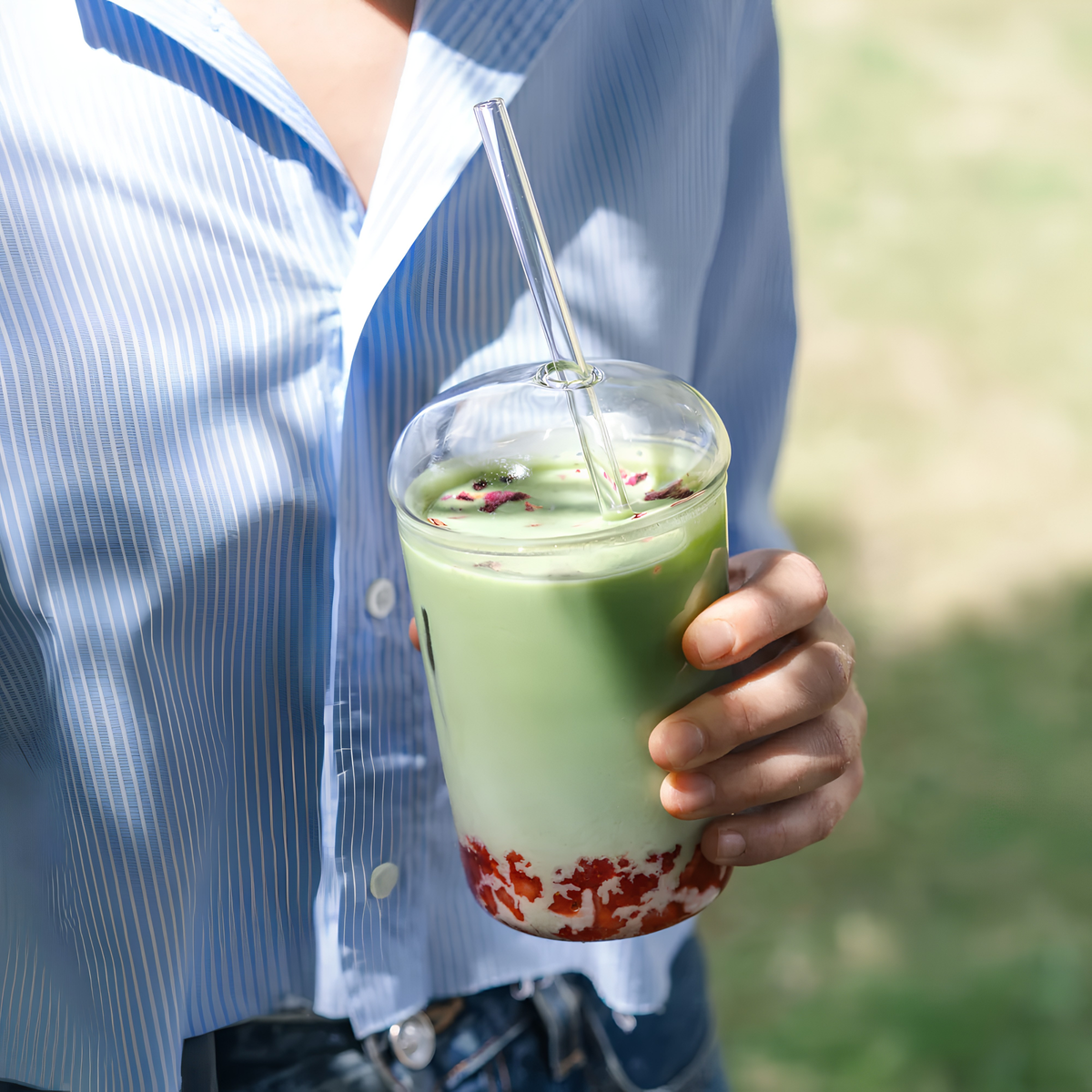 A matcha mixture inside a tumbler, from Storm & India Mood Matcha grown on pristine organic farms, shaped by volcanic soils and warm ocean air in Pouch 100g