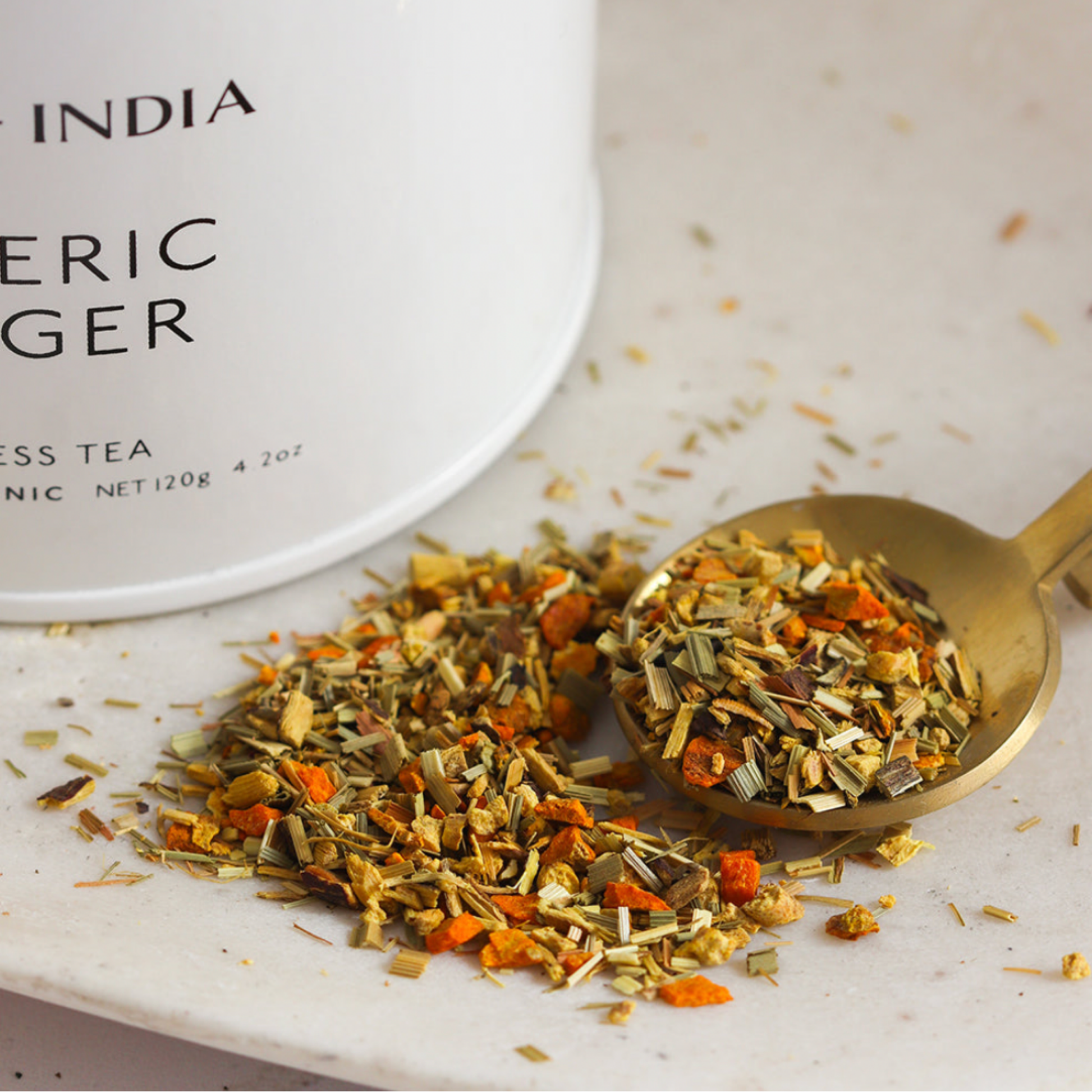 Storm and India Loose Leaf Tea in Tin 150g Tumeric & Ginger with spoon loose leaf tea on display 
