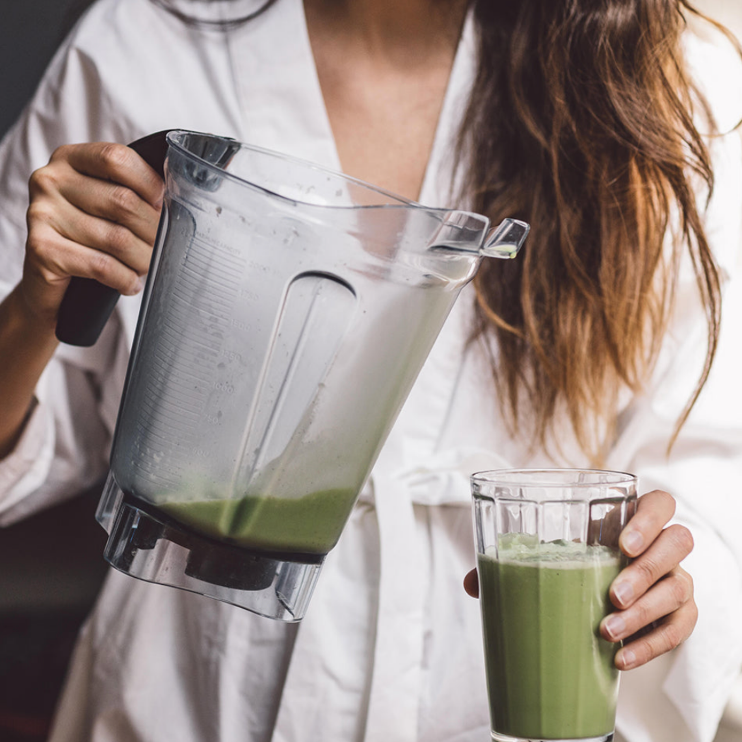 Woman using Matcha in Tin 30g Zen Matcha to make smoothie 