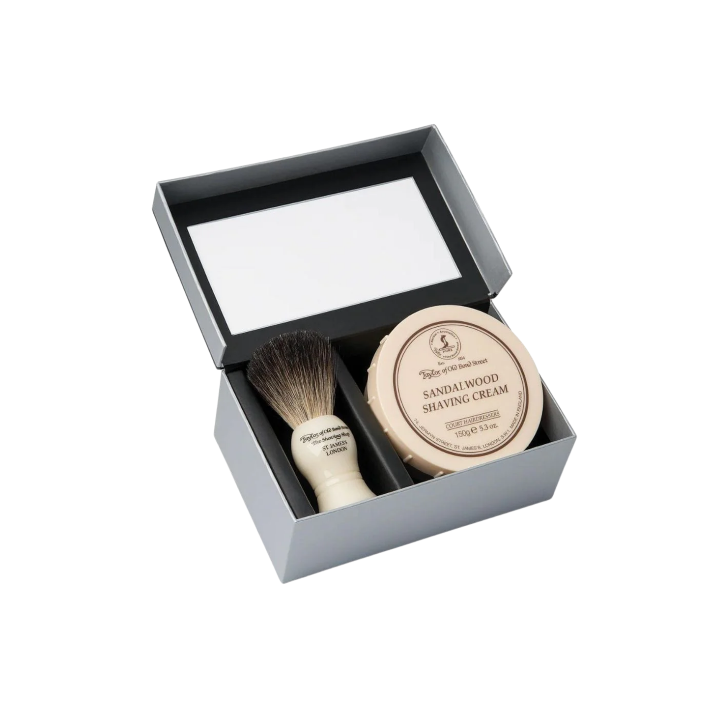 Shaving set box with shaving cream bowl and shaving brush in box with open lid front view