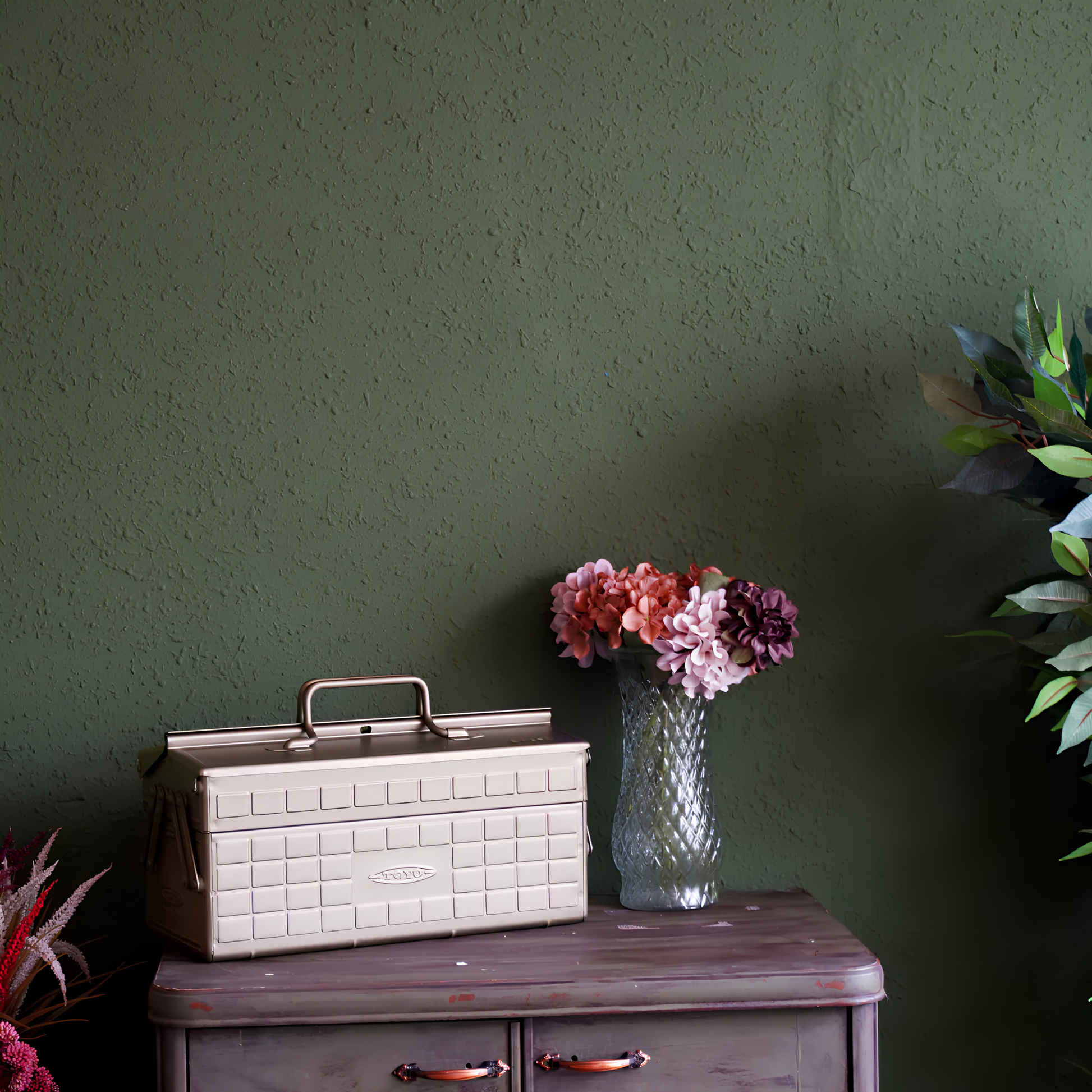 Side view on top of a cabinet the Toyo Toolbox Cantilever ST-350 crafted from pressed steel from a single sheet with sleek and stylish design, dual handle two tier design, comes with 8 removable tray dividers.