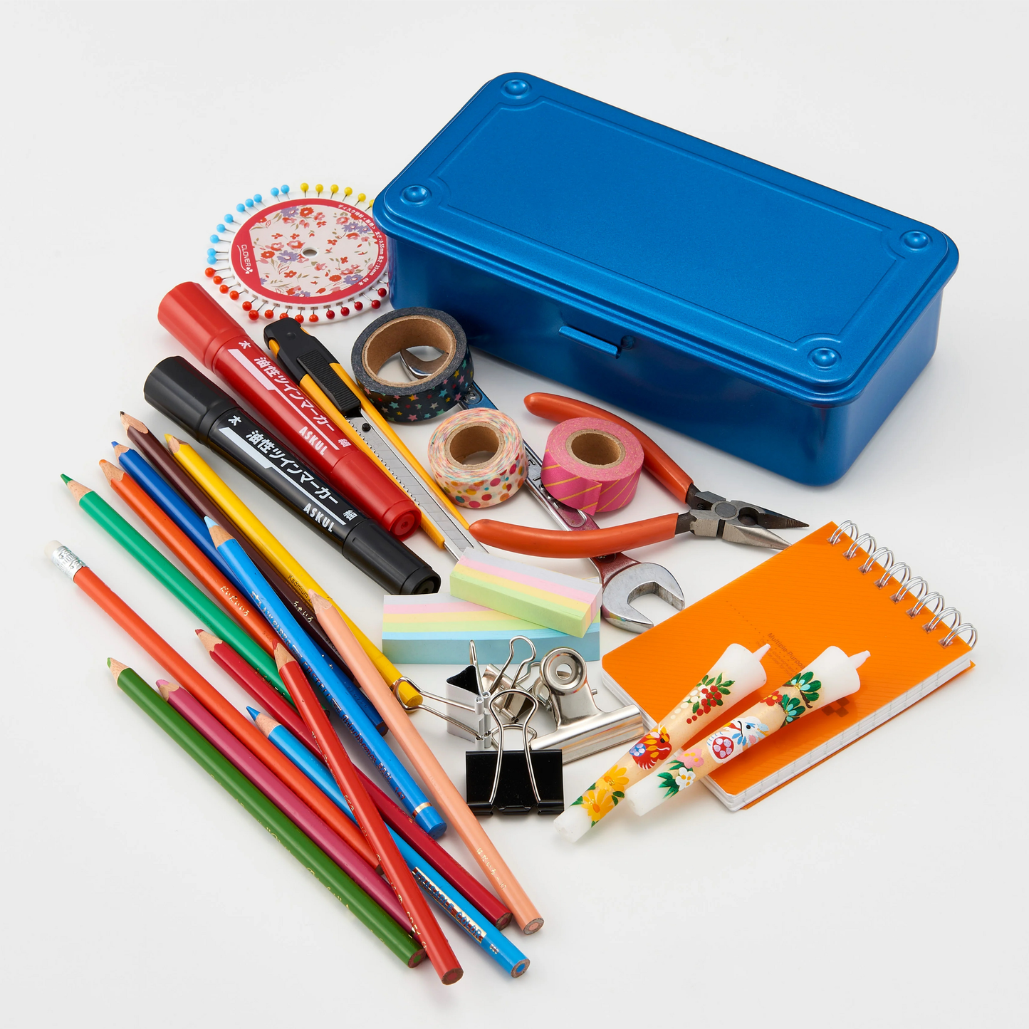 Showing hand tools beside the close Toyo Toolbox Trunk Shape T-190 Blue from pressed steel, palm size design and has matte texture as general storage box