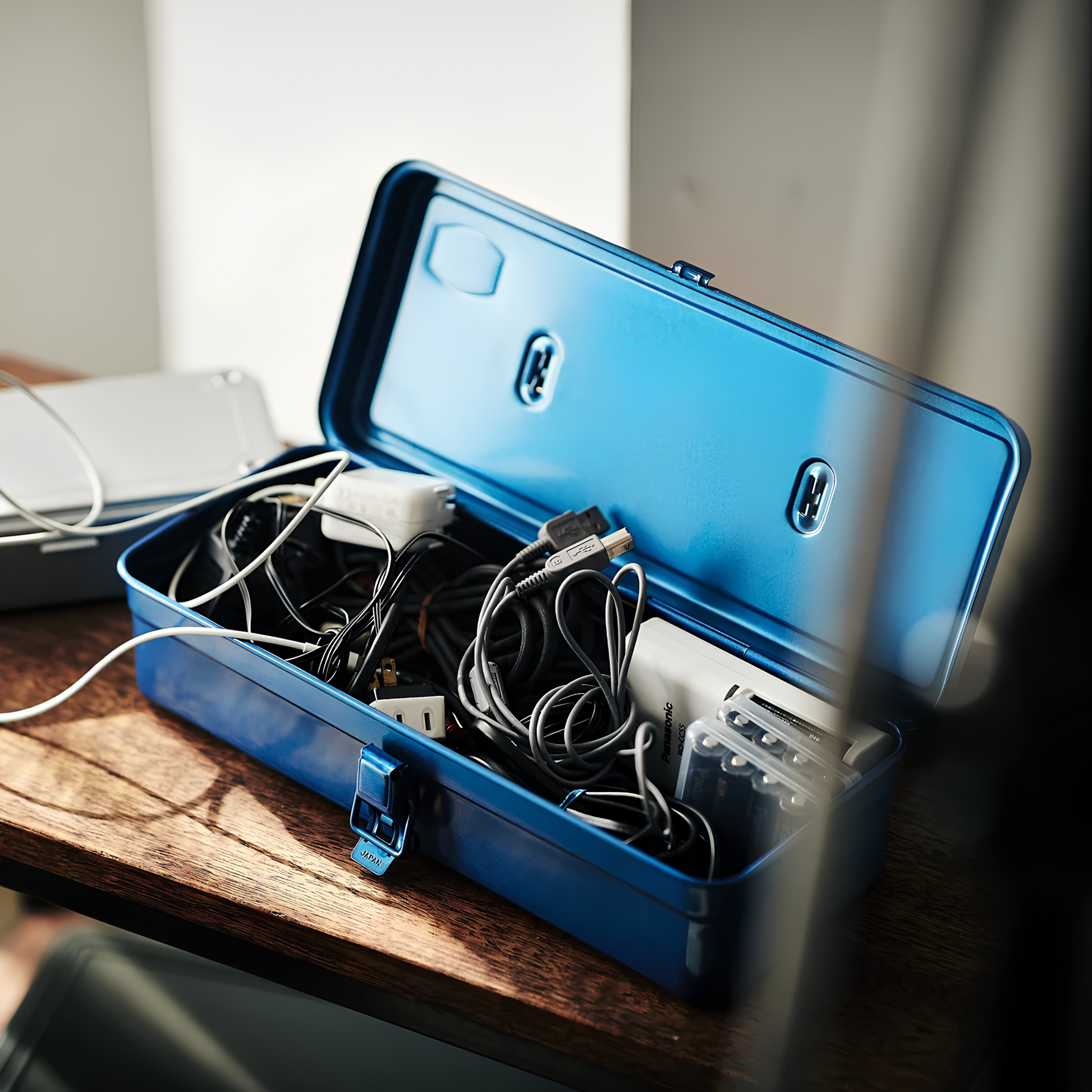 Open with gadget accessories inside the Toyo Toolbox Trunk Shape T-320 Blue with ample storage capacity and sleek stylish look.