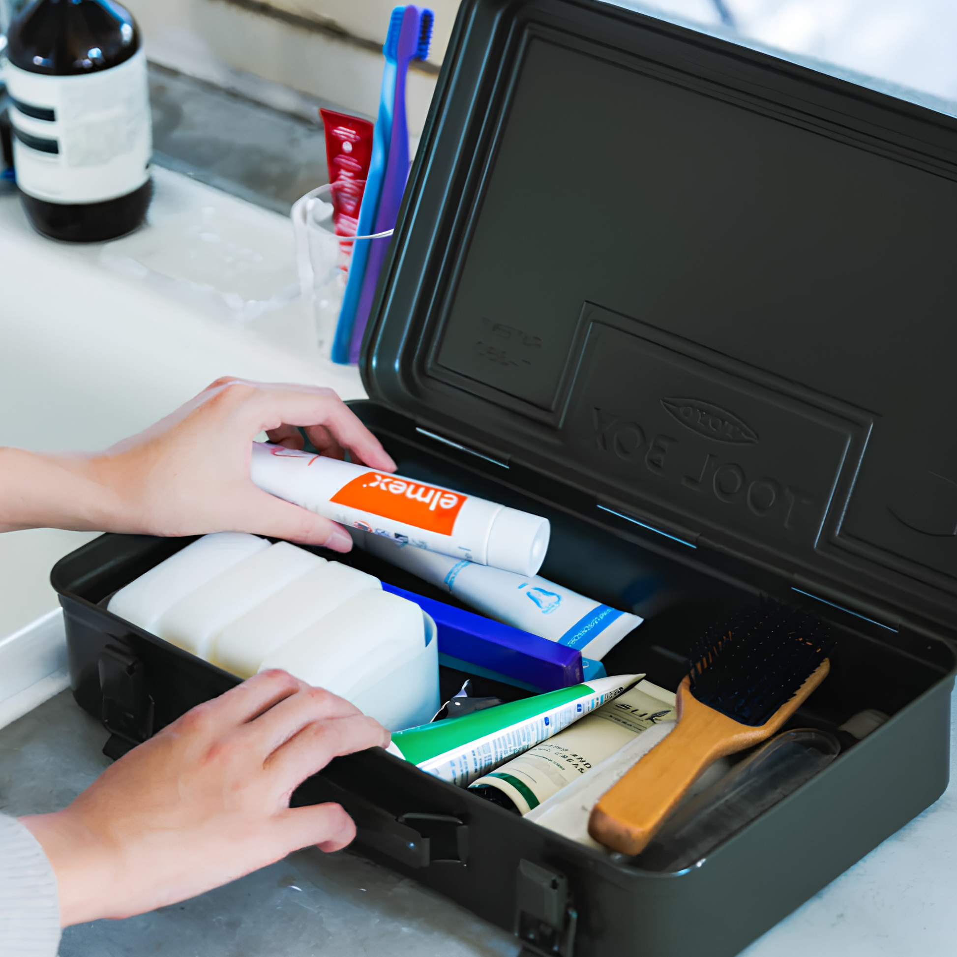 Grooming materials inside the Toyo Toolbox Trunk Shape Toolbox T-360 Black made from pressed steel plate, matte with no sharp edges.