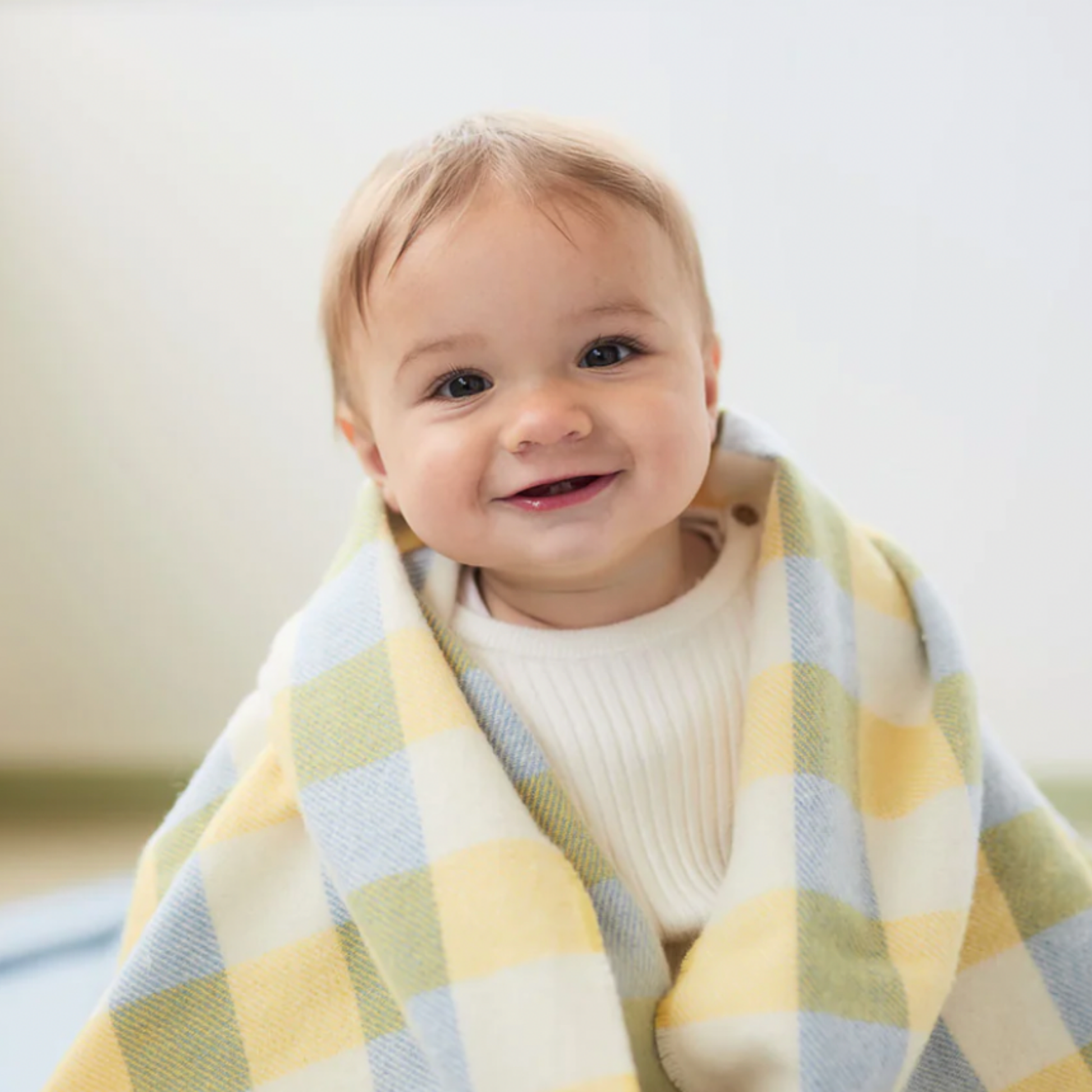 Baby wrapped in Waverly Mills baby blanket 