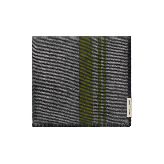 Folded Waverley Mills Field Blanket Charcoal from military origins, charcoal whip stitch fringe, and recycled wool in charcoal and grey with green stripe.