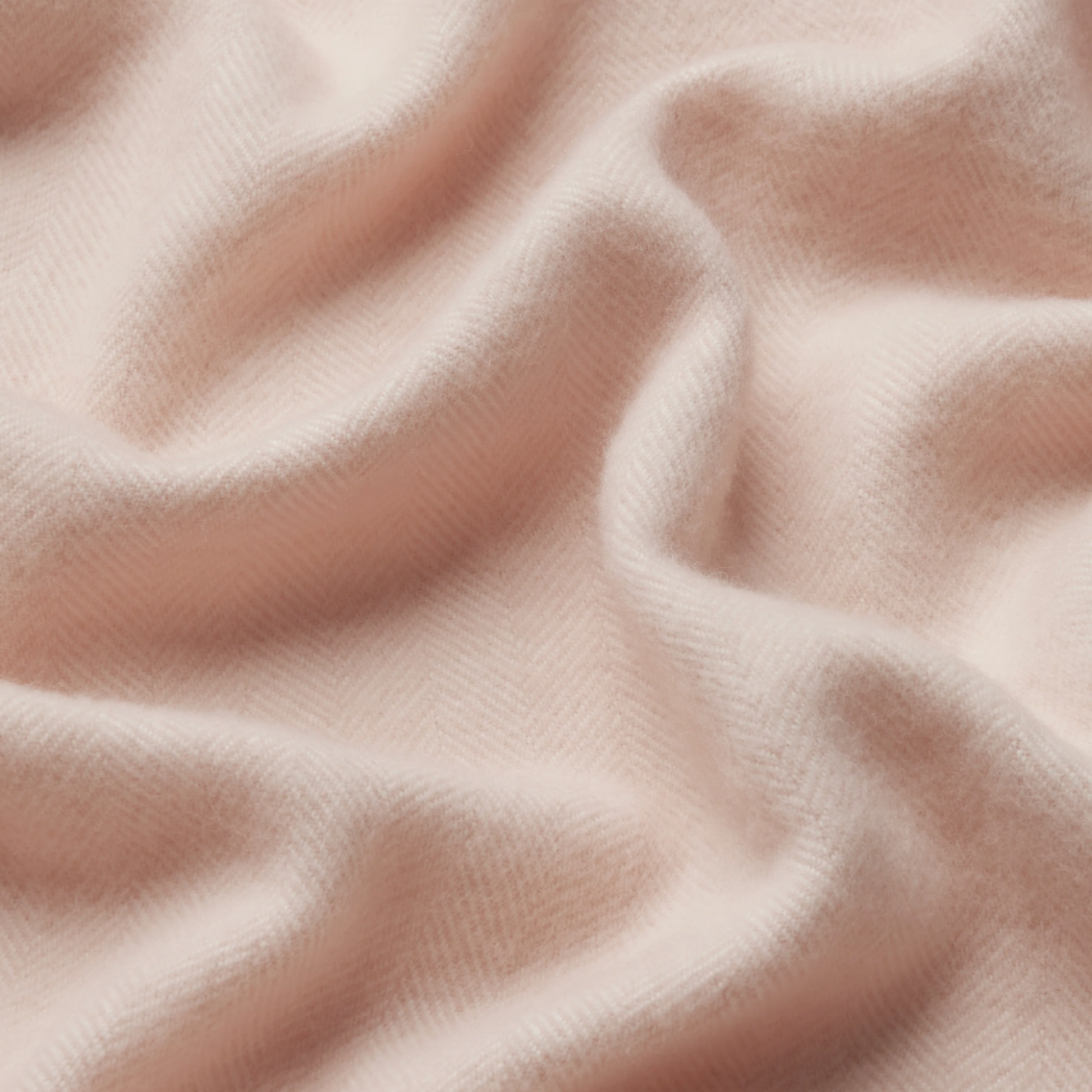 Close up of Waverly Mills herringbone throw in blush