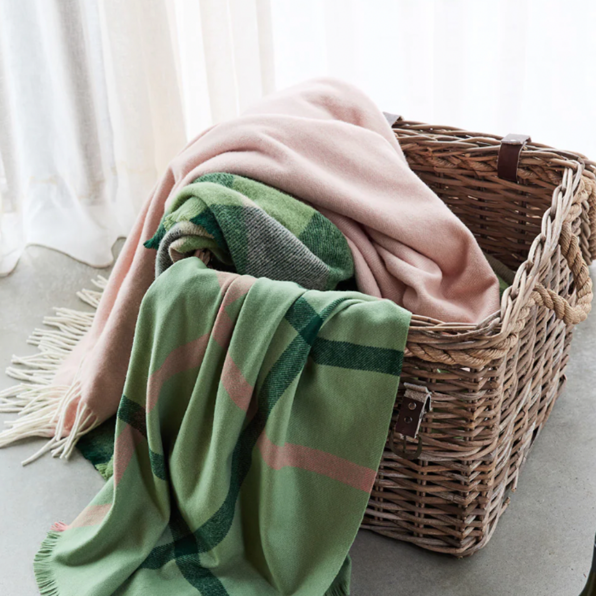 Waverly Mills herringbone throw blush in basket with other Waverly Mills throws