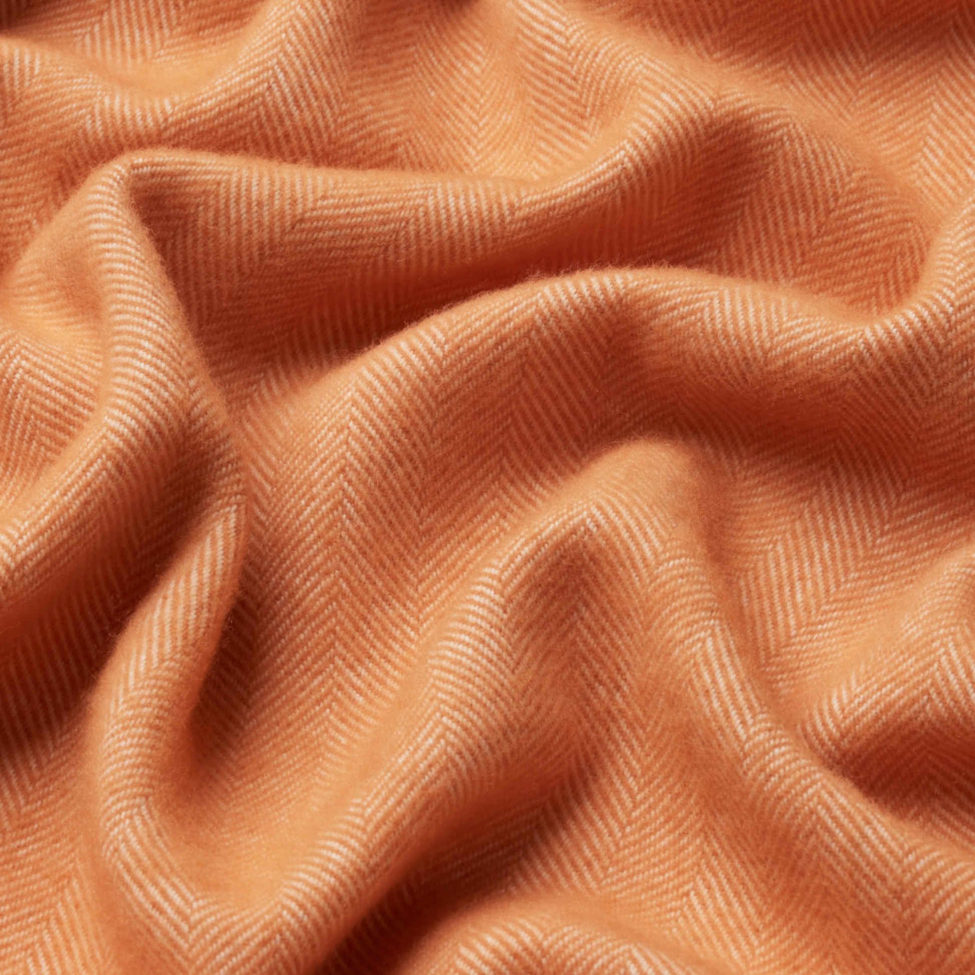 Close up of Waverly Mills herringbone throw in ginger