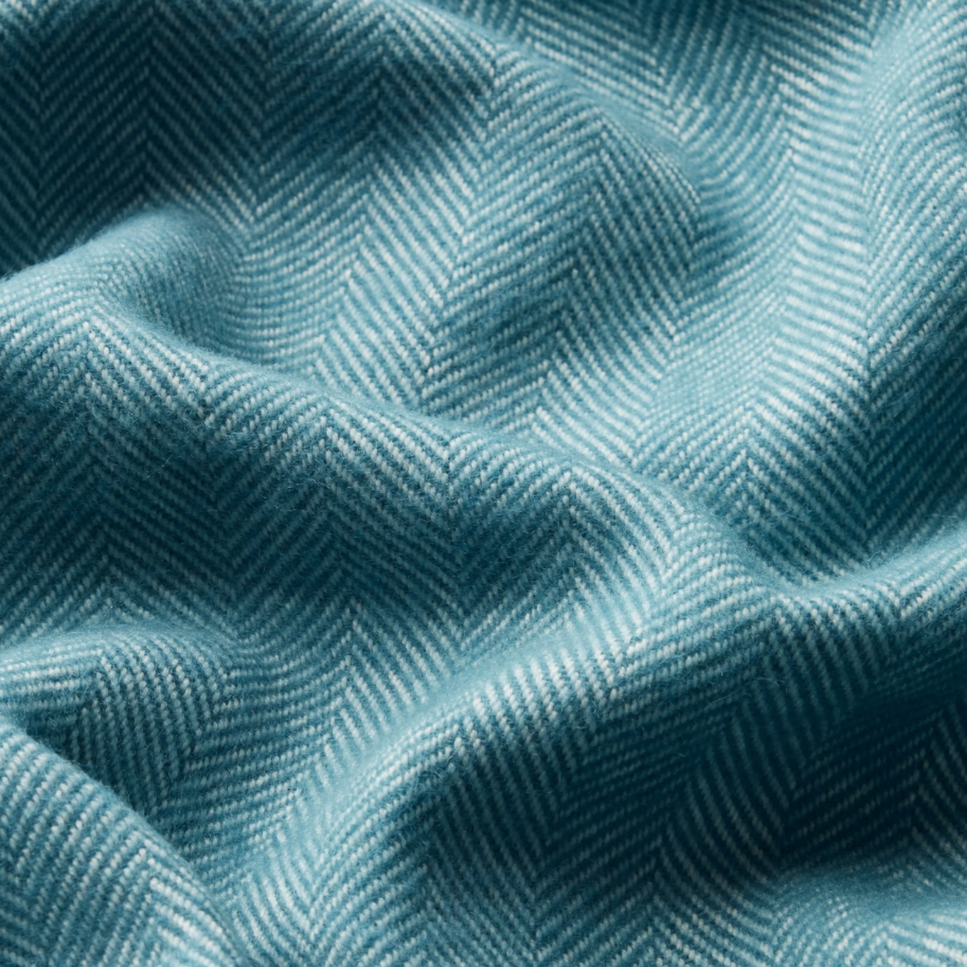 Close up of Waverly Mills herringbone throw in indian teal