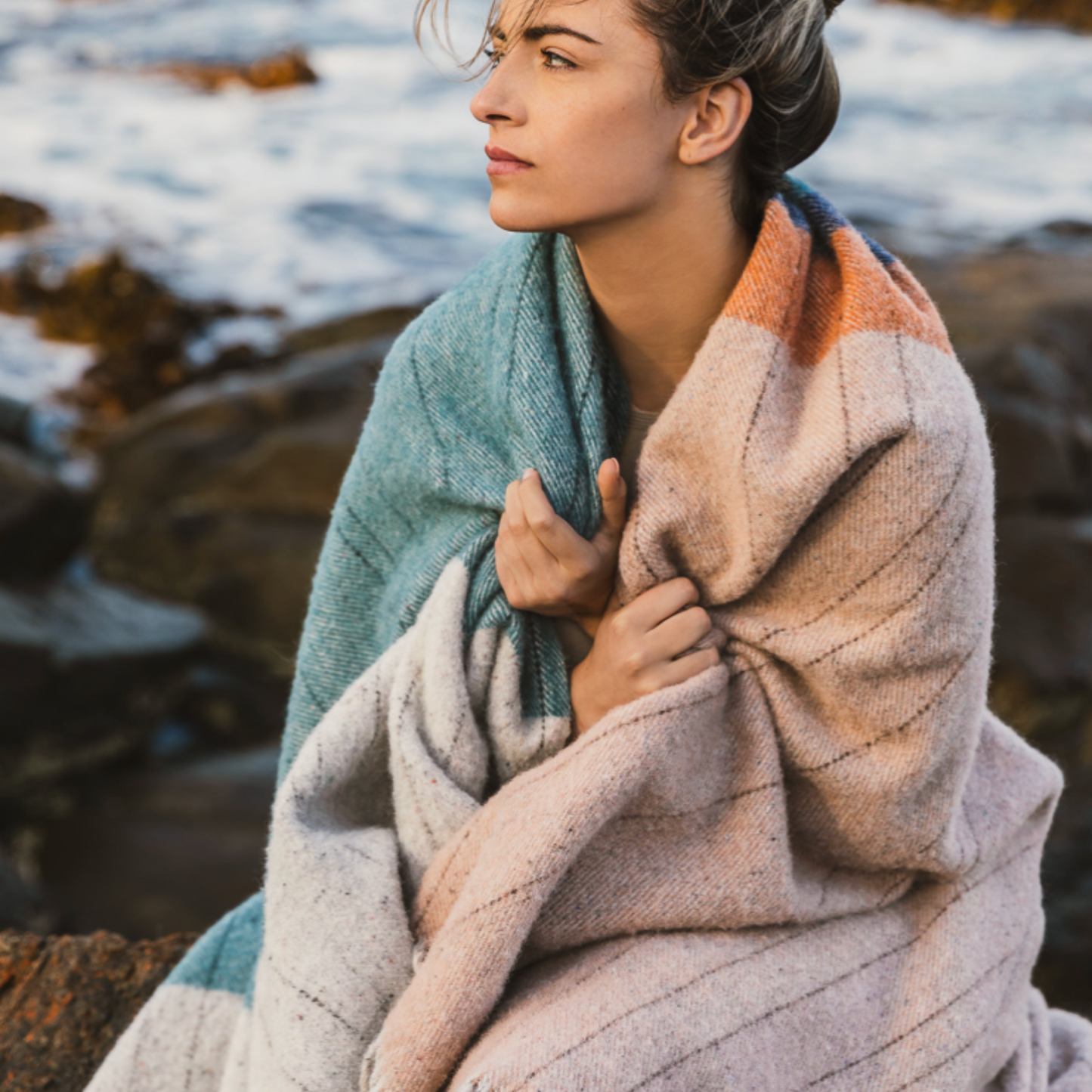 Woman with Waverly Mills Terrain Throw Bay of Fires wrapped around her outside