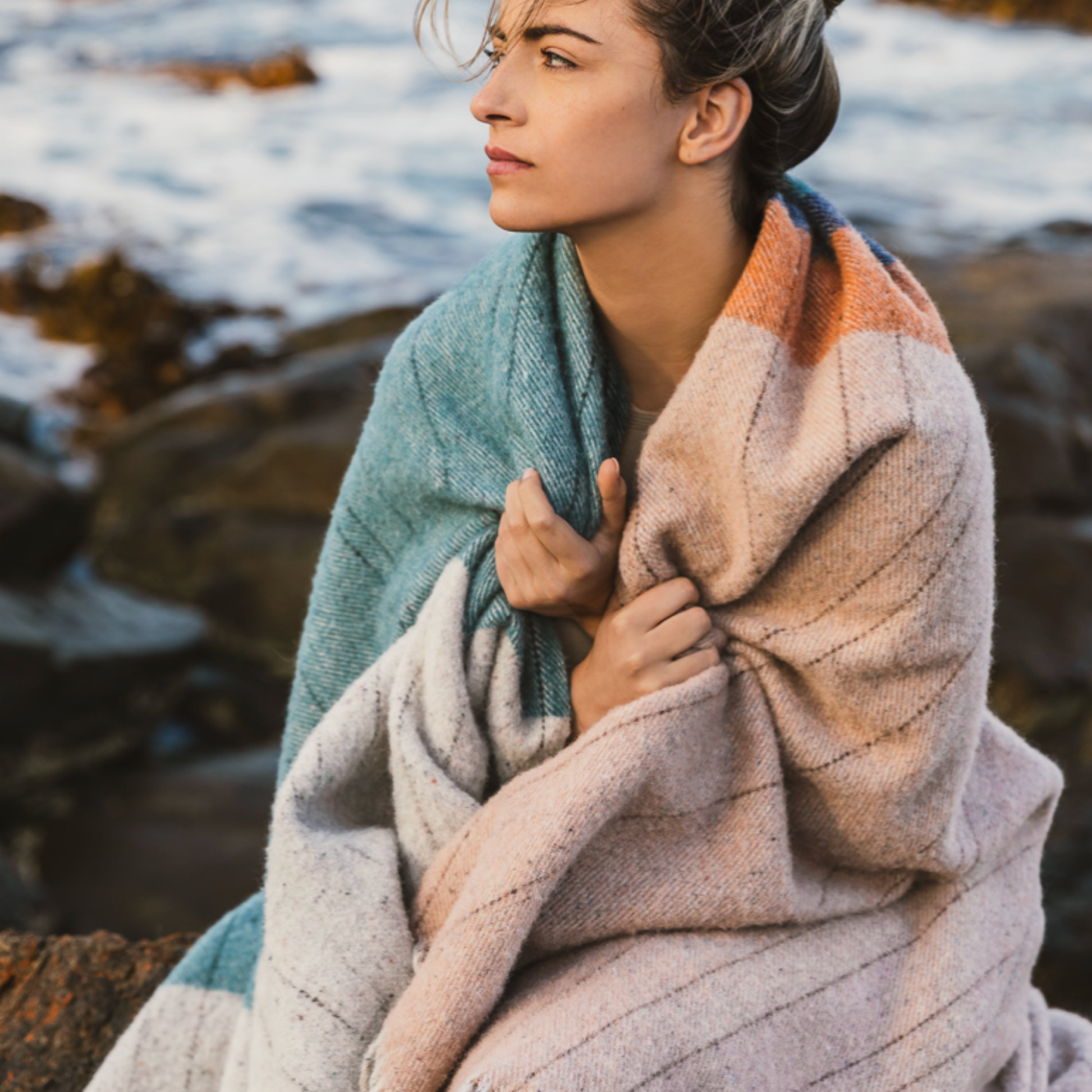 Woman with Waverly Mills Terrain Throw Bay of Fires wrapped around her outside