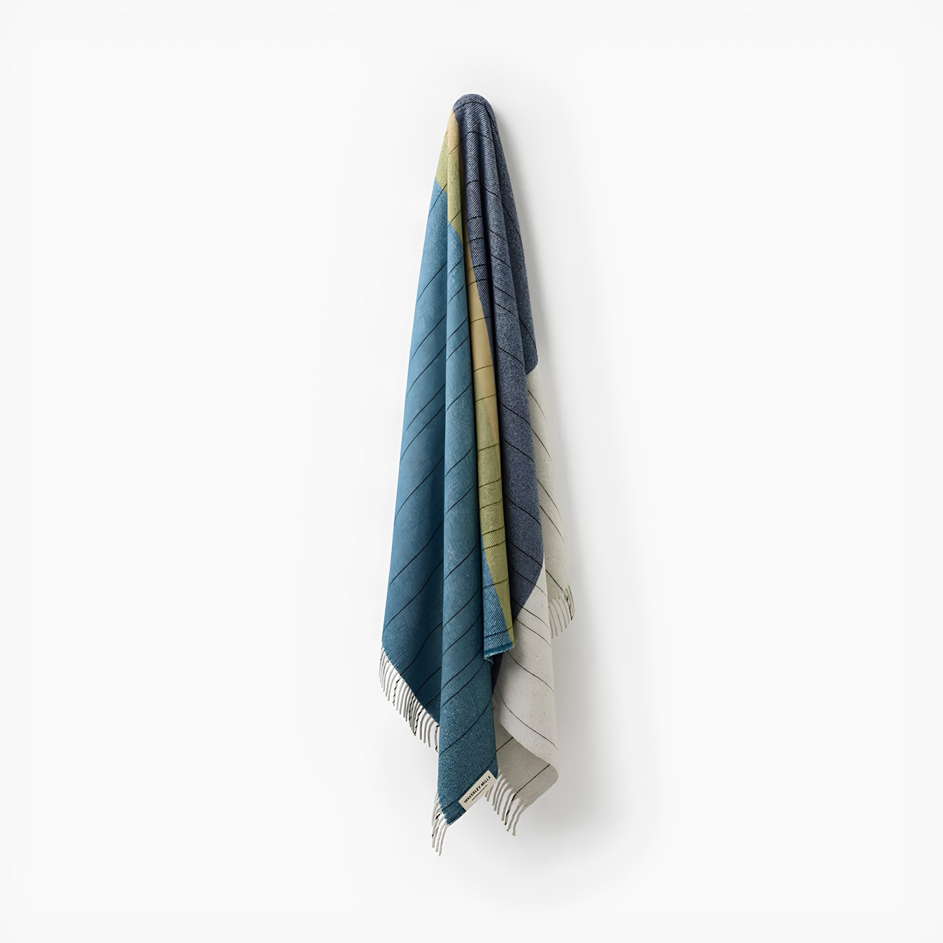 Hung on the wall, the Waverley Mills Terrain Throw Three Capes inspired by Tasmania's dramatic coastal trail, made from wool.